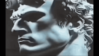 Close Up Of Statue Man Face On Black Background GIF