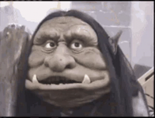 Close Up Of Troll Puppet With Long Hair GIF