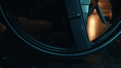 Close Up Of Wheel With Person Reflection GIF