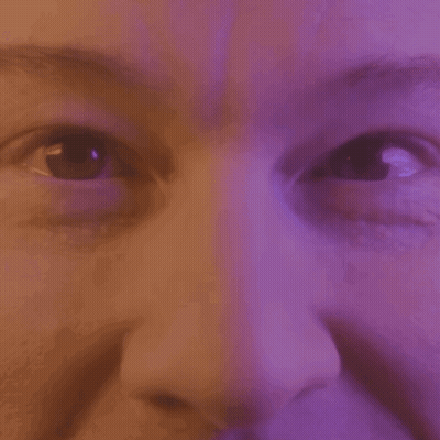 Close Up Of Woman Eyes And Nose Purple Background GIF