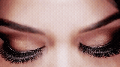 Close Up Of Woman Eyes With Long Eyelashes And Eyeshadow GIF