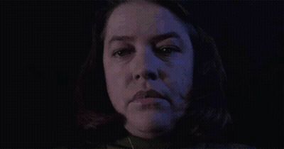 Close Up Of Woman Face Against Blue Background GIF