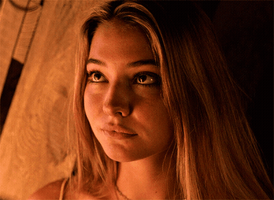 Close Up Of Woman Face With Brown Background GIF
