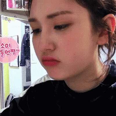 Close-Up Of Woman Face With Sign Saying Adi GIF