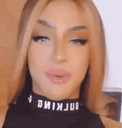 Close-Up Of Woman In Black Top And Choker GIF
