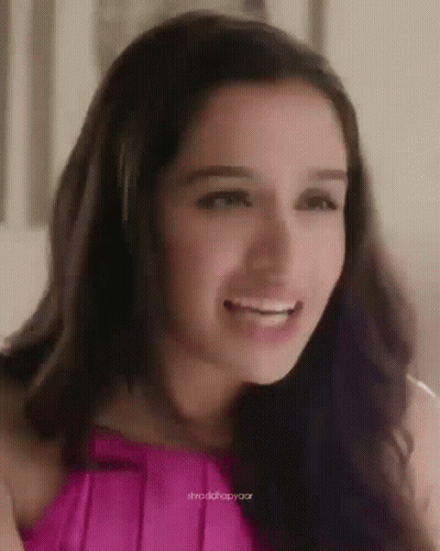 Close-Up Of Woman In Pink Top GIF
