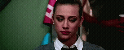Close Up Of Woman In Tie And Sweater GIF