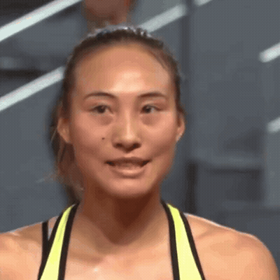 Close Up Of Woman In Yellow Tank Top GIF