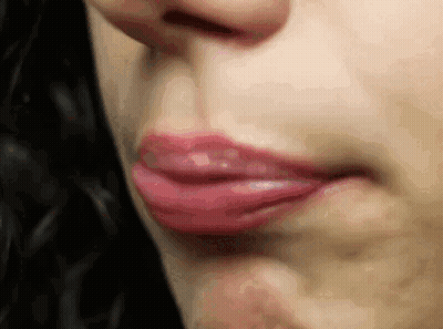 Close Up Of Woman Lips On Black Background GIF