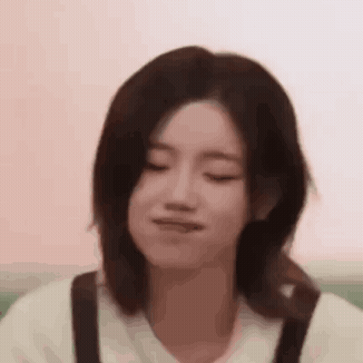 Close Up Of Woman Making Face With Eyes Closed GIF