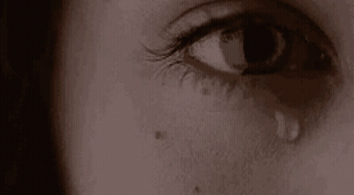 Close Up Of Woman's Crying Eye With Tear GIF