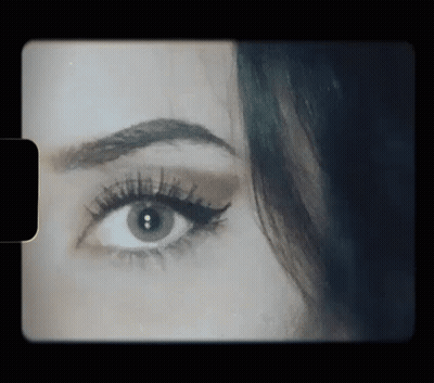 Close Up Of Woman's Eye On Black Background GIF