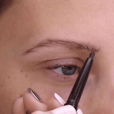 Close Up Of Woman's Eye With Black Pencil GIF