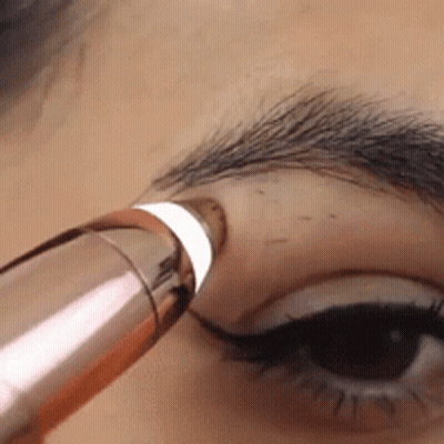 Close Up Of Woman's Eye With Brush GIF
