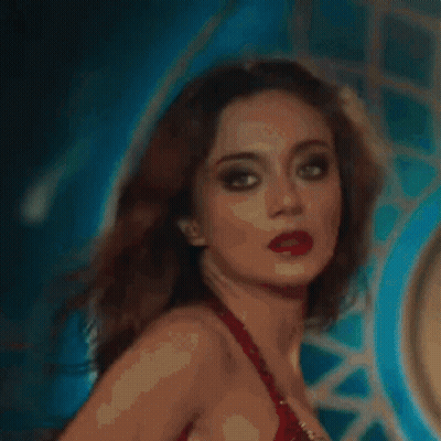 Close Up Of Woman's Face In Blurry Photo GIF