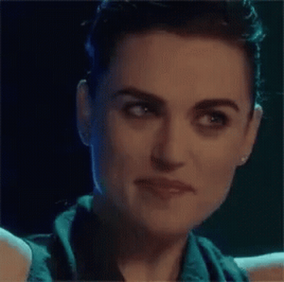Close Up Of Woman's Face In Dark Room GIF