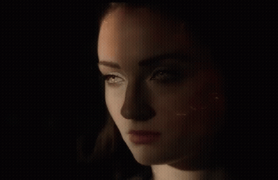 Close Up Of Woman's Face In The Dark GIF