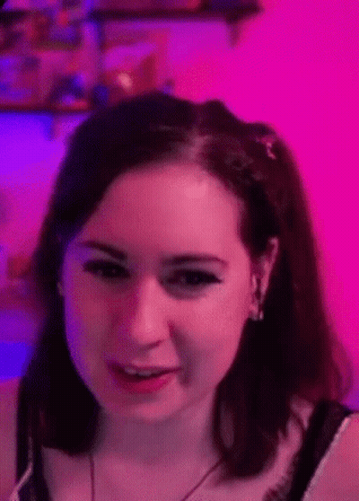 Close Up Of Woman's Face On Pink Background GIF