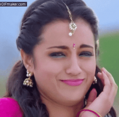 Close Up Of Woman's Face With Bindi And Earrings GIF