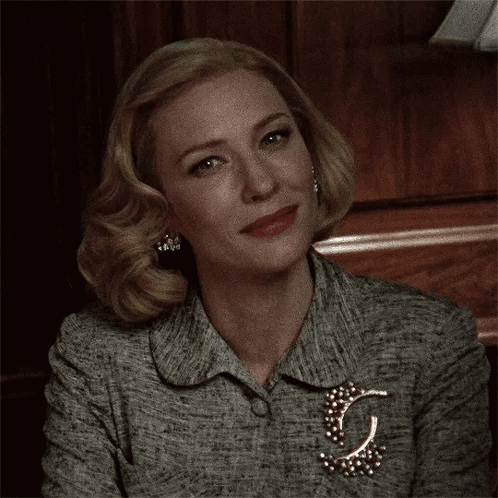 Close Up Of Woman's Face With Brooch GIF