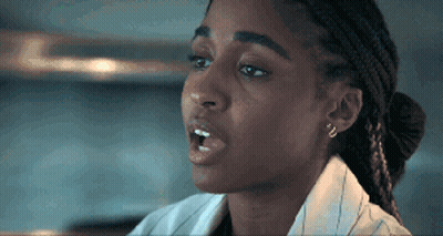 Close Up Of Woman's Face With Bun GIF