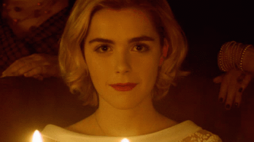 Close Up Of Woman's Face With Candle In Front GIF