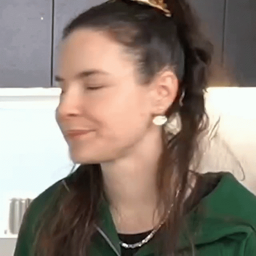 Close Up Of Woman's Face With Eyes Closed And Ponytail GIF