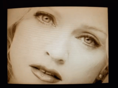 Close Up Of Woman's Face With Green Eyes GIF