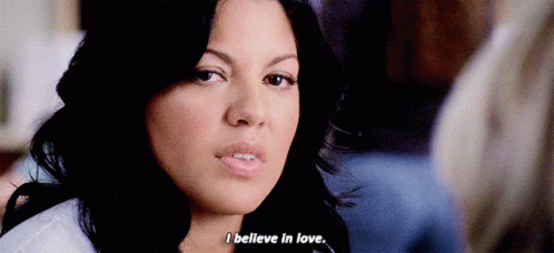 Close Up Of Woman's Face With I Believe In Love GIF