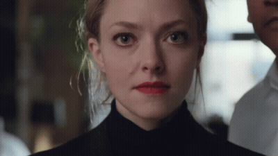 Close Up Of Woman's Face With Man In Background GIF