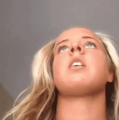 Close Up Of Woman's Face With Mouth Open Looking Up GIF