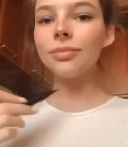 Close Up Of Woman's Face With Nose Ring And White Shirt GIF