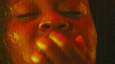 Close Up Of Woman's Face With Yellow And Red Background GIF