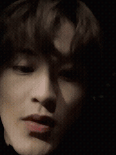 Close Up Of Woman's Face With Yellow Background GIF