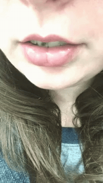 Close Up of Woman's Lips With Gray Shirt