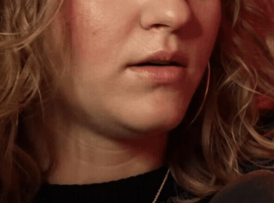 Close Up Of Woman's Mouth With Black Shirt GIF
