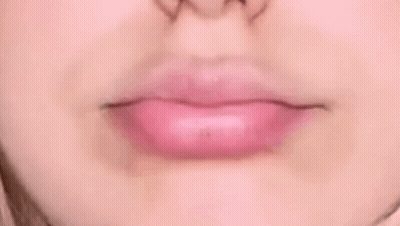 Close Up Of Woman's Mouth With Pink Lipstick GIF