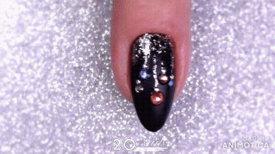 Close Up Of Woman's Nails With Rhinestones GIF