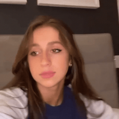Close Up Of Woman Sitting In Chair GIF