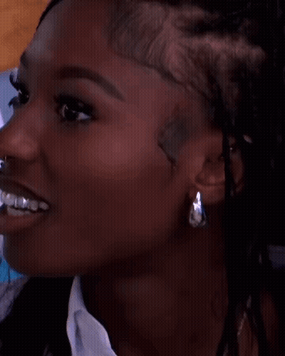Close-Up Of Woman Smiling With Earrings GIF