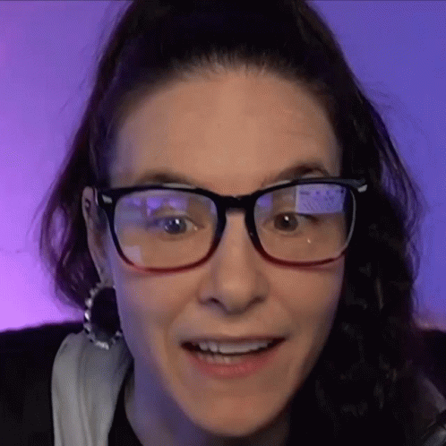 Close Up Of Woman Wearing Glasses And Smiling GIF