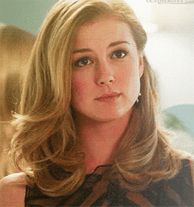 Close Up Of Woman With Blonde Hair And Earrings GIF