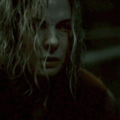 Close Up Of Woman With Ceiling Light In Background GIF