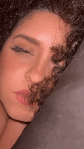 Close Up Of Woman With Curly Hair And Pink Lips GIF