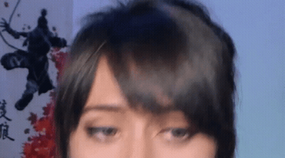 Close Up Of Woman With Drawing Of Man In Background GIF