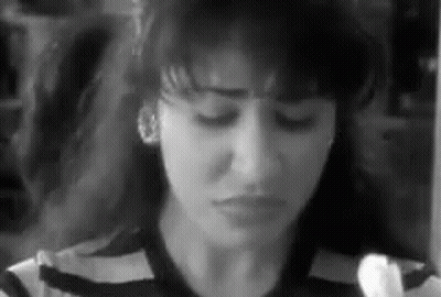 Close Up Of Woman With Eyes Closed Black And White GIF