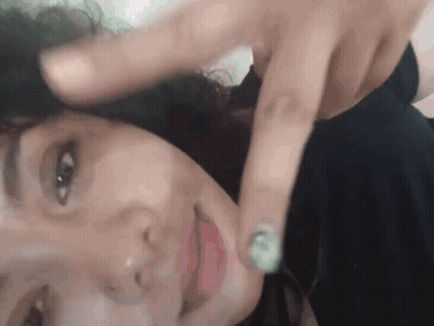 Close Up Of Woman With Finger On Face GIF