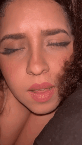 Close Up Of Woman With Half Eye Closed GIF