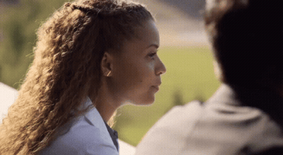Close Up Of Woman With Man Behind Her GIF