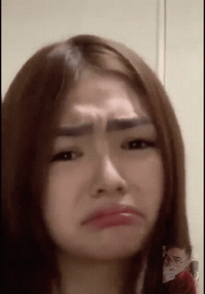 Close Up Of Woman With Man In Background GIF